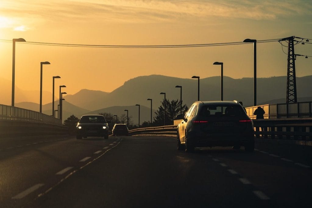 car, transport, driving, bridge, lamp, post, nature, sunset, sun, sunrise, car wallpapers, tarmac, asphalt, road, street, hills, mountains, sky, orange, clouds, driving, driving, driving, driving, driving