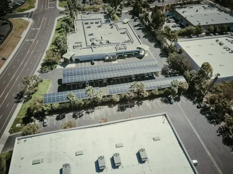 Drone shot of solar panels in a city showcasing sustainable energy use.