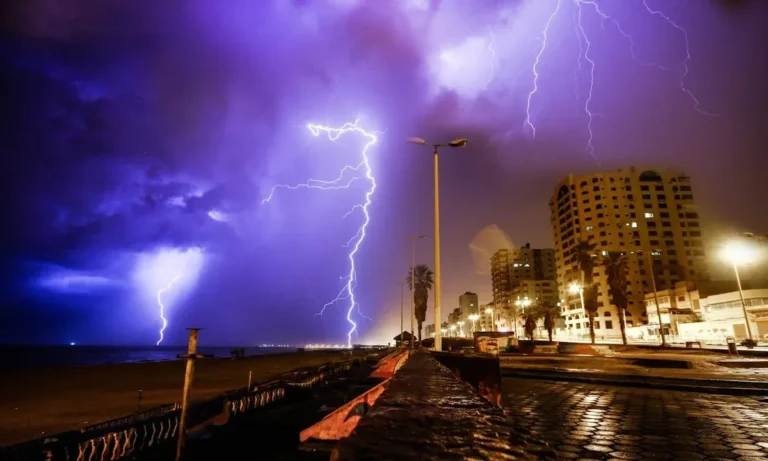 Dramatic lightning storm over Gaza city shoreline, capturing nature's raw power.