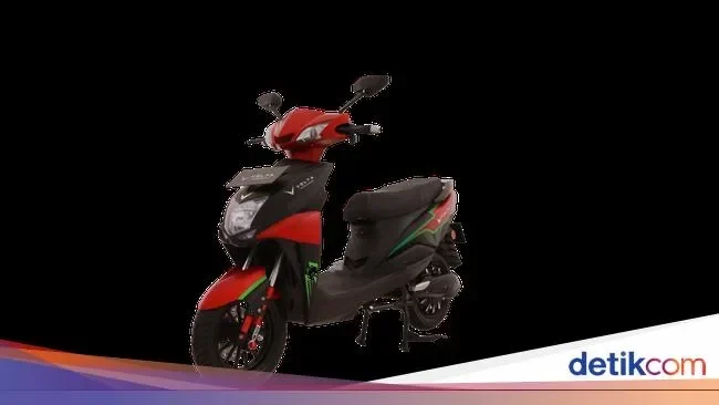 Motor listrik berwarna merah dan hitam, representasi insentif pajak kendaraan ramah lingkungan.