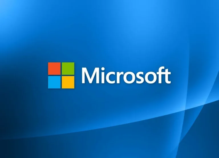 Logo Microsoft berwarna putih dengan ikon empat kotak warna-warni di latar belakang biru.
