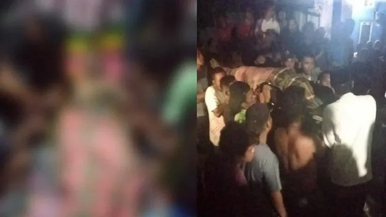 Warga berkerumun di lokasi kejadian, memperhatikan area yang diburamkan terkait insiden.