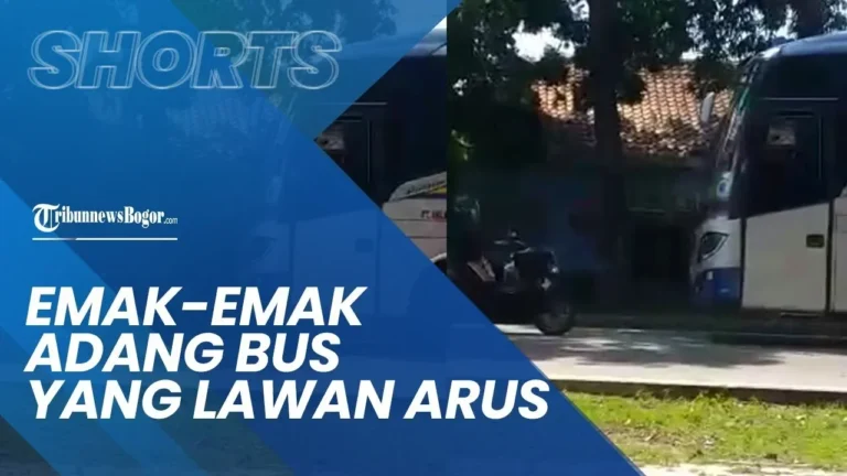 Pemotor Yamaha Nmax menghadang laju bus di jalanan berbahaya, terekam dalam video viral.