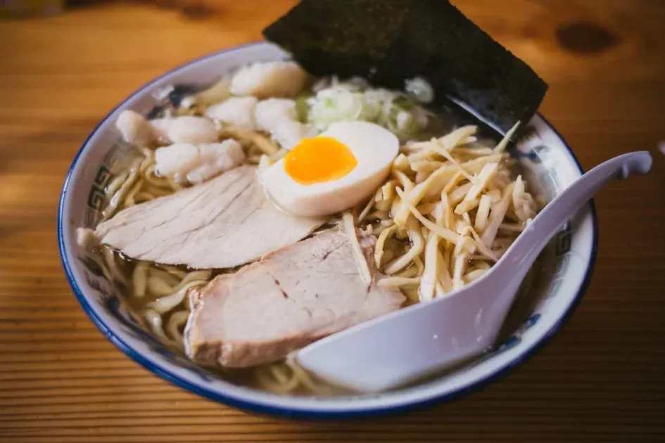 Savor the taste of authentic Japanese ramen with pork, egg, and fresh toppings in a warm broth.