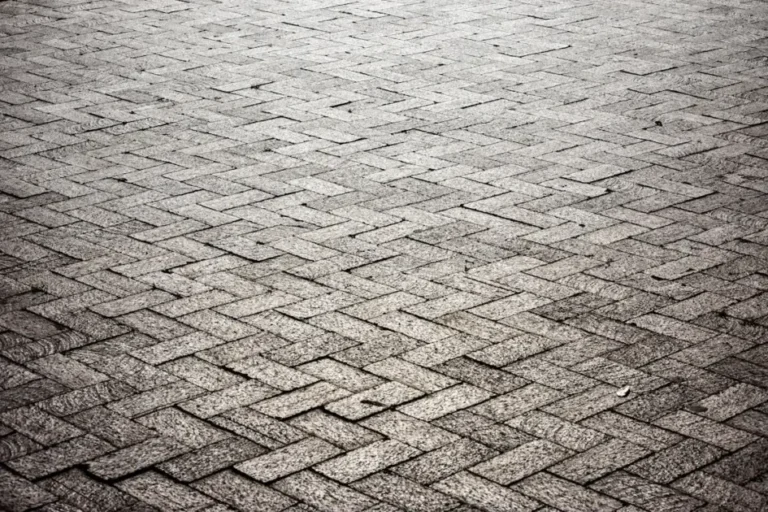 brown brick floor near body of water during daytime